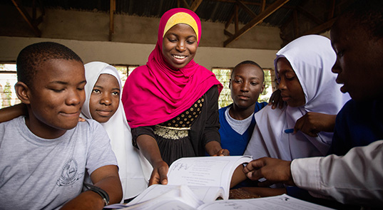 Camfed Learner Guide delivering life skills lesson.