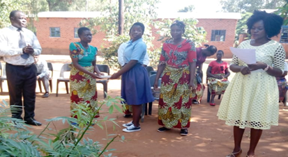Faith, secondary student Malawi receiving an award