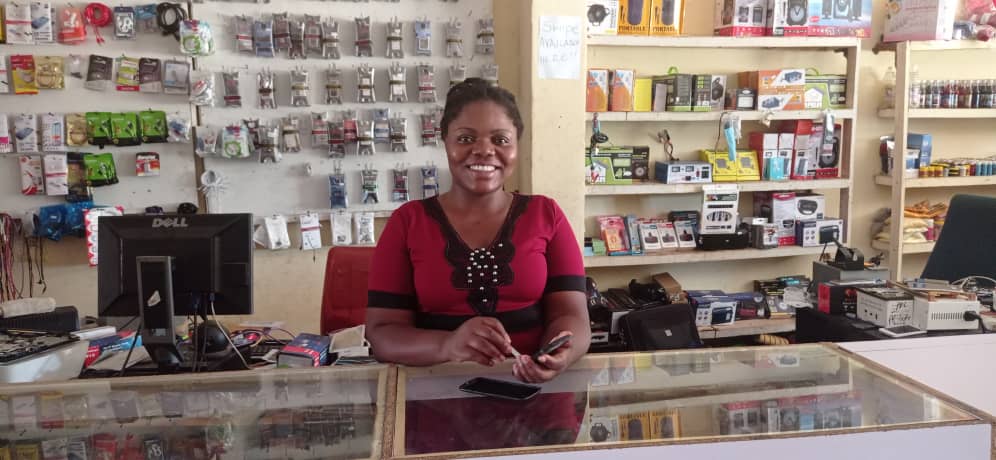 CAMFED Association entrepreneur Happiness in her mobile repair and tech shop